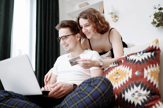 A couple shopping online using a credit card