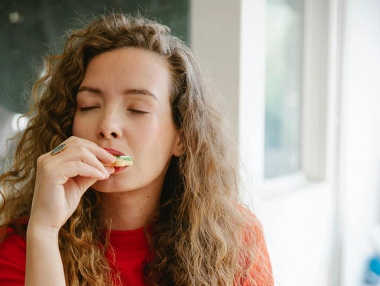 Woman eating a cookie